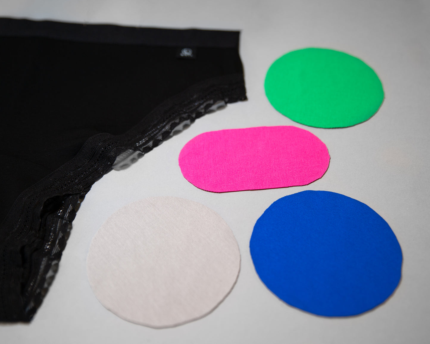 Closeup photo of the five colours available for The Bamboo High Cut; black, green, pink, light grey and blue. All colours except the black are limited editions and can run out.