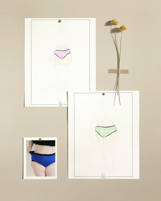 An example of how to use a fashion croquis. Two fashion croquis are pinned on a light colourd wall, with a pink and green knickers sketched out. Two drid flowers are tape to the wall to the top right and at the bottom left is a photo of a model wearing a pair of blue knickers.