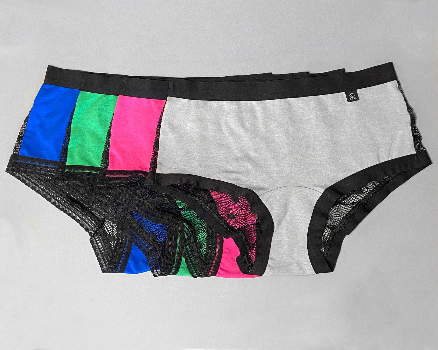 Full front view of four samples of The Mix Hipster, showing the avalible colours you can choose from; grey, pink, green and blue.
