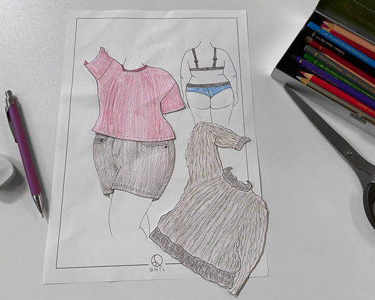 Example of how to use our Fasion Croquis to test diffrent outfits on a plus sized body. We have used the template to draw diffrent garment and cut them out, so we can test diffrent combinations on a figure wearing underwear. Next to the dressed figure are some coloured pens, a pair of scissors, and  a pencil.