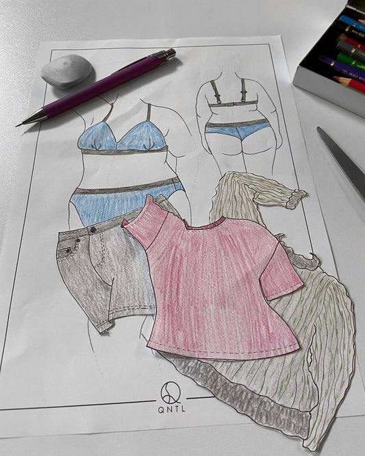 Example of how to use our Fasion Croquis to test diffrent outfits on a plus sized body. We have used the template to draw diffrent garment and cut them out, so we can test diffrent combinations on a figure wearing underwear. Next to the dressed figure are some coloured pens, a pair of scissors, and  a pencil.