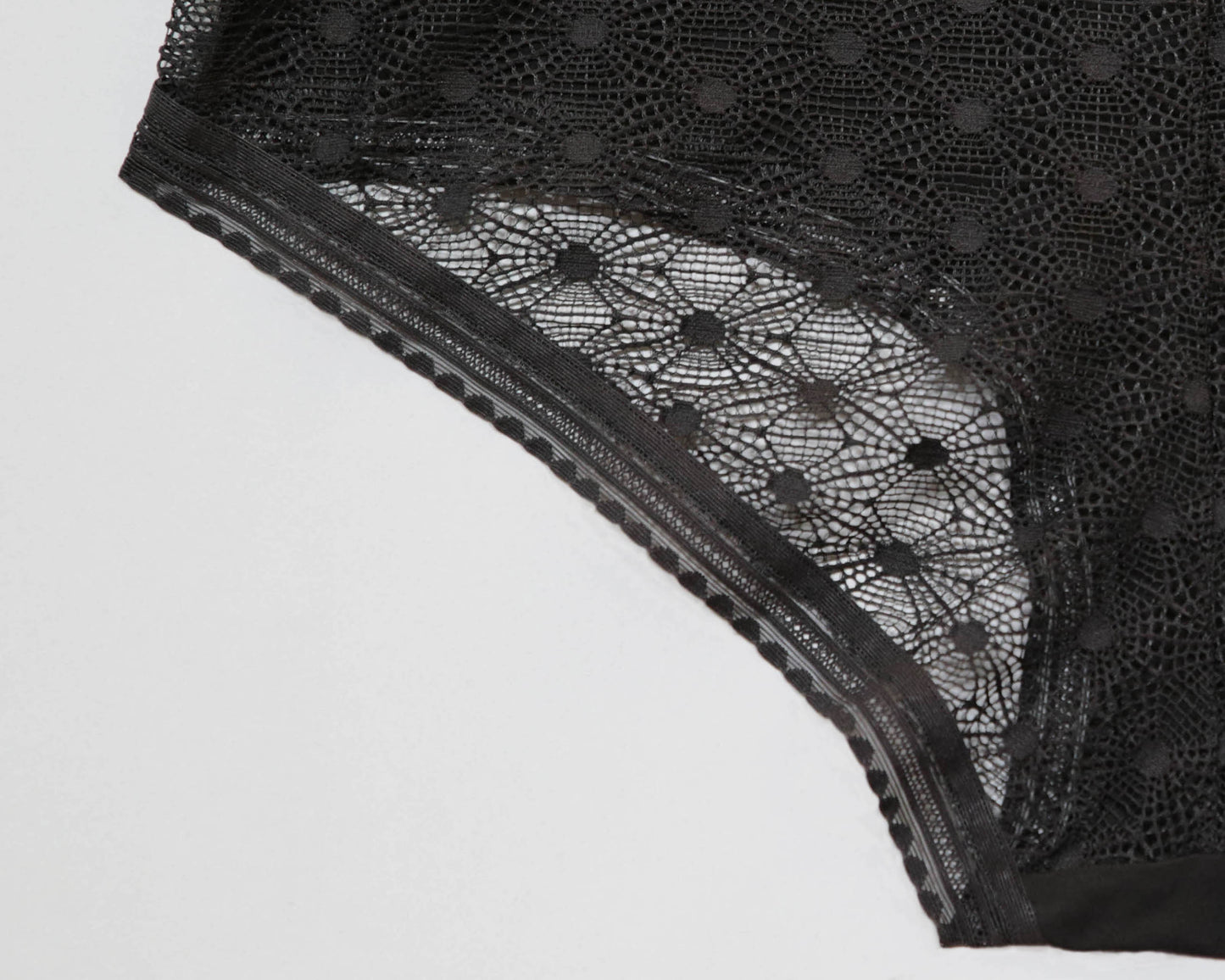 Closeup of the standard elastic option, showing the graphic pattern in the elastic against the lace on the back panel.