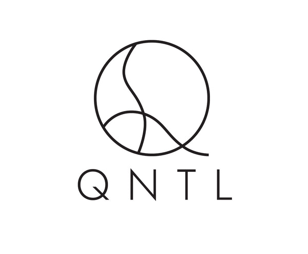 QNTL’s logo, which consists of a stylized letter Q with a female from inside and the letters QNTL underneath.